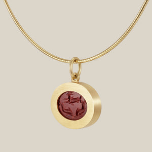 Oval Slice Pendant — Capricorn and Dolphins